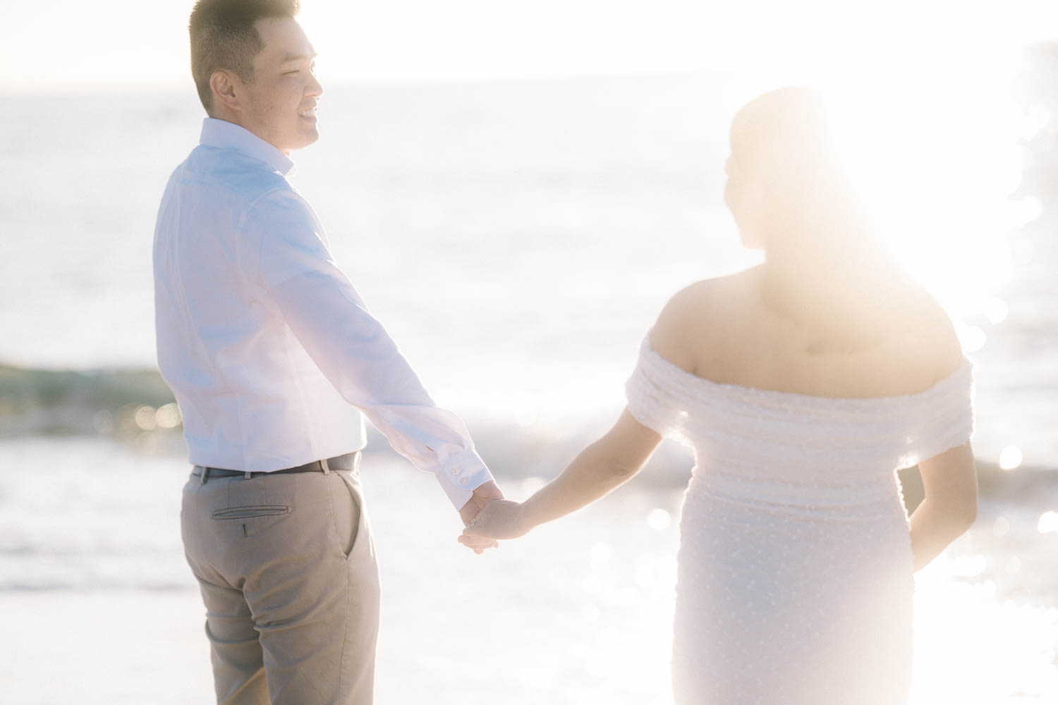 Tender silhouette of expecting parents at sunrise, Sydney calm, relaxed maternity session by family photographer Born in November.