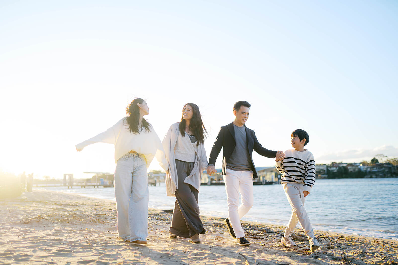Natural family photo with soft colour palette and casual outfits