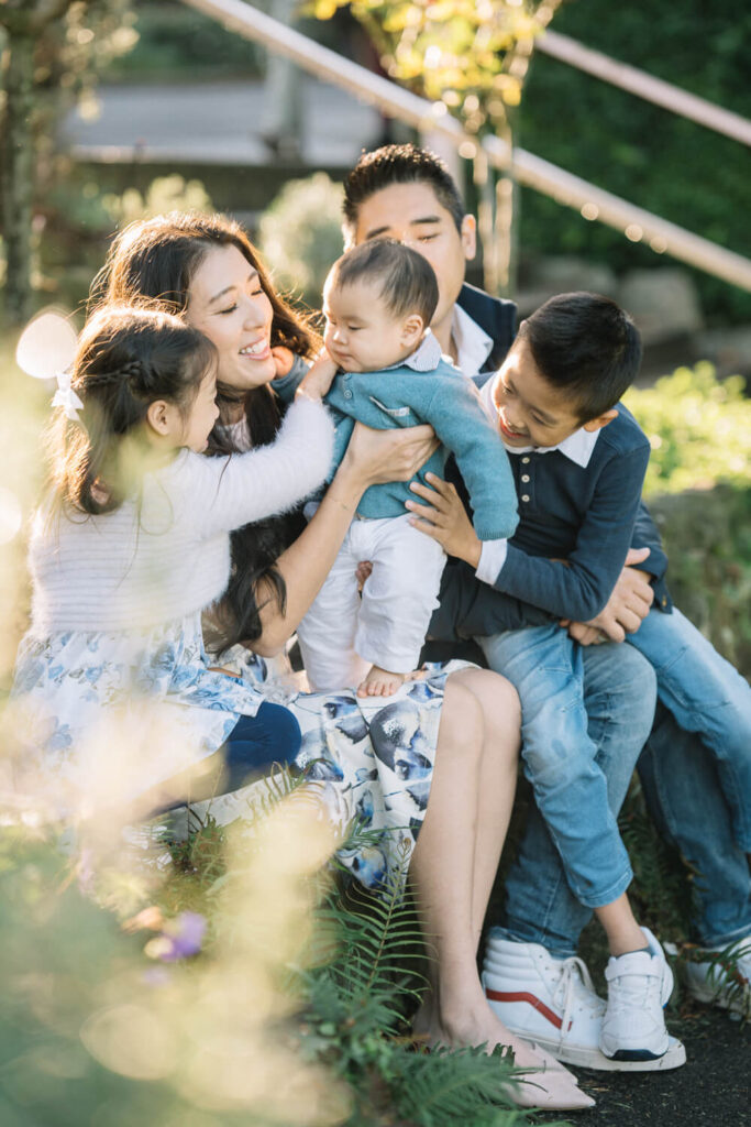 Family portrait with pet dog in a Sydney garden setting