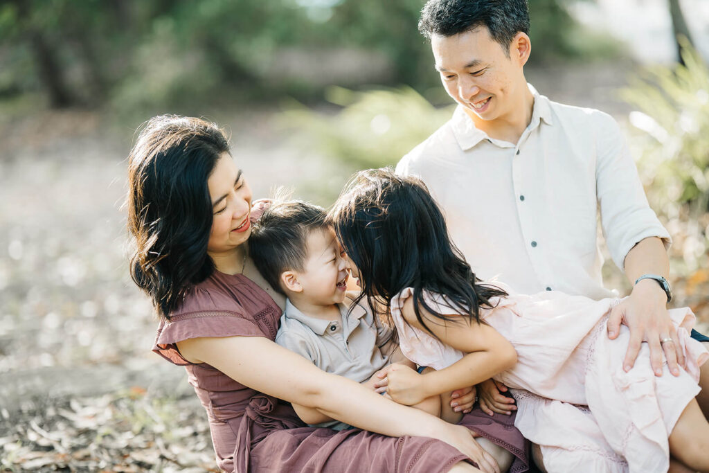 Coordinated neutral outfits for family photo with toddlers outdoors