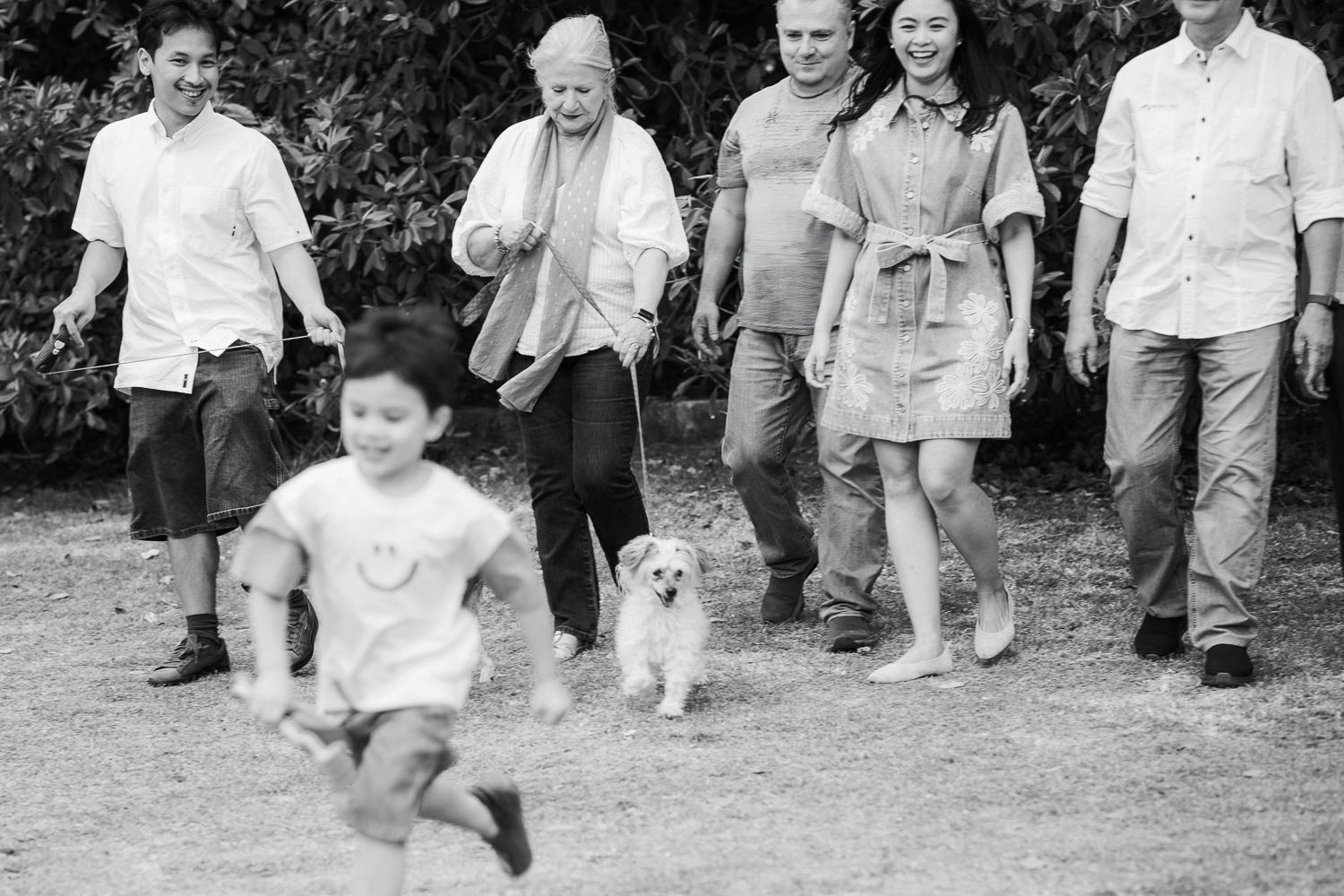 Young child running away from family happily